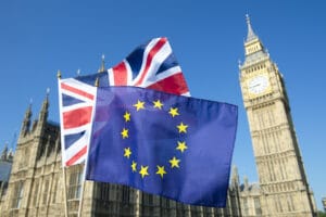 European Union and British Union Jack flag flying in front of Big Ben and Westminster Palace, London, in preparation for the Brexit EU referendum
